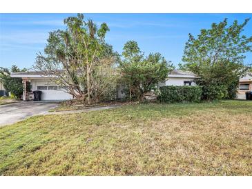 Ranch-style home with a large yard and mature landscaping at 2846 Pinellas Point S Dr, St Petersburg, FL 33712