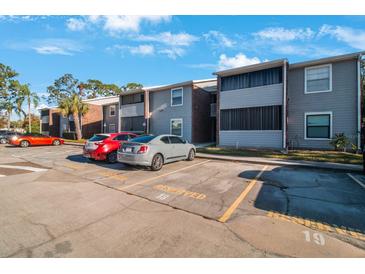 Exterior view of condo building with parking at 1400 Gandy N Blvd # 715, St Petersburg, FL 33702