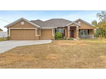 Single-story house with a two-car garage and manicured lawn at 478 Fieldstone Ln, Spring Hill, FL 34606