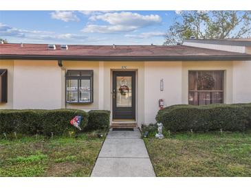 Inviting front exterior of a single-story home with a well-maintained walkway and landscaping at 11511 113Th St # 27C, Largo, FL 33778