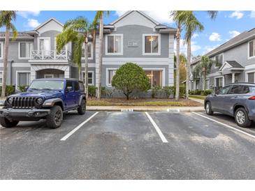 Front exterior of a two-story townhome with assigned parking at 18183 Paradise Point Dr, Tampa, FL 33647