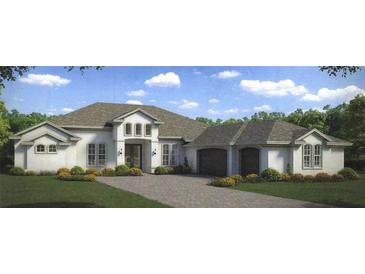 Beautiful two-story home with a three-car garage and landscaped yard at 5325 Lake Toscana Dr, Wimauma, FL 33598