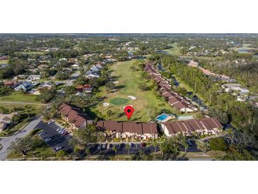 Aerial view of condo community near golf course at 6211 Timber Lake Dr # B8, Sarasota, FL 34243