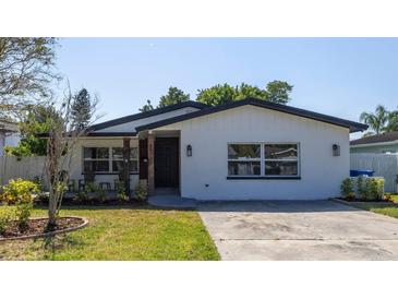 Updated bungalow with modern exterior and landscaped yard at 4511 Helena Ne St, St Petersburg, FL 33703