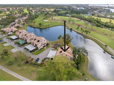 Aerial view of condo community, showcasing property location and golf course views at 1328 Pelican Creek Xing # D, St Petersburg, FL 33707