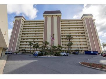 High-rise building with parking and landscaping at 4775 Cove Cir # 904, St Petersburg, FL 33708