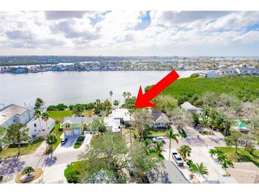An aerial view of a waterfront home in a residential neighborhood at 307 10Th Ave, Indian Rocks Beach, FL 33785