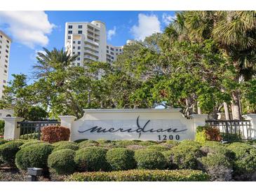 Meridian 1200 building entrance with lush landscaping at 1200 Gulf Blvd # 206, Clearwater Beach, FL 33767