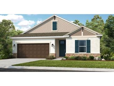 Charming single-story home with a brown garage door, stone accents, and teal shutters at 5130 Slate Hue Pl, Apollo Beach, FL 33572