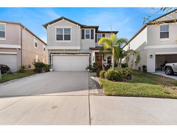 Charming two-story home with a festive holiday theme at 9334 Lemon Drop Loop, Sun City Center, FL 33573