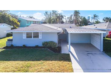 Updated single story home with carport and well maintained landscaping at 2460 Terry Ln, Sarasota, FL 34231