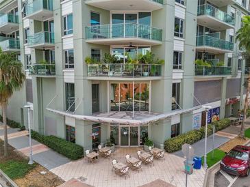 Stylish condo building exterior with lovely balconies and outdoor seating area at 111 N 12Th St # 1306, Tampa, FL 33602