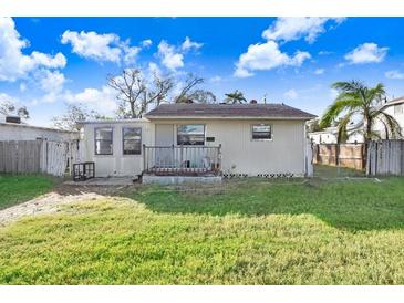 One-story home with a small front porch and yard at 154 81St N Ave, St Petersburg, FL 33702