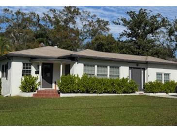 Charming single story home with well-manicured lawn at 3801 N Ridge Ave, Tampa, FL 33603