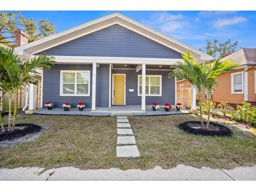 Charming craftsman home with a welcoming front porch and nicely landscaped lawn at 1716 22Nd N Ave, St Petersburg, FL 33713