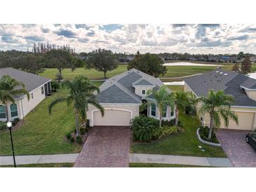 Property view showcasing the home's location and surrounding golf course at 1847 Pacific Dunes Dr, Sun City Center, FL 33573
