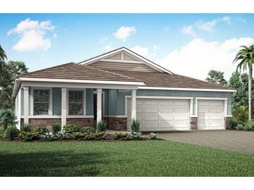 Charming single-story home with a three-car garage and landscaped yard at 18472 Vista Park Ter, Venice, FL 34293