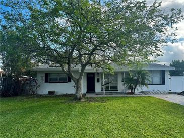 Updated Ranch home with a large front yard and mature tree at 4561 Shore Acres Ne Blvd, St Petersburg, FL 33703