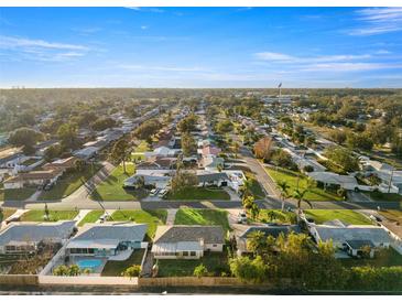 Aerial view of a residential neighborhood with single-Gathering homes and lush landscaping at 9167 108Th St, Seminole, FL 33772