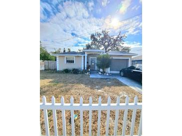 Charming single story home with a manicured yard and lovely curb appeal on a sunny day at 4150 15Th S Ave, St Petersburg, FL 33711