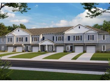 Attractive townhomes with gray siding, white trim, and attached garages at 11770 Blackbrook Ct, Seffner, FL 33584