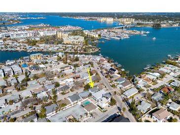 Aerial view of a charming house with a pool, situated in a waterfront neighborhood at 255 146Th Ave E, Madeira Beach, FL 33708