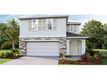 Two-story house with stone accents and a two-car garage at 5259 Salt Marsh Rd, Wimauma, FL 33598