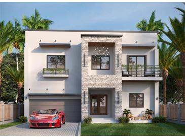 Modern two-story home with attached garage and balcony at 1003 W Ohio Ave, Tampa, FL 33603