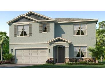 Two-story house with light-blue siding, gray roof, and a two-car garage at 18306 Wheathouse Pl, Lakewood Ranch, FL 34211