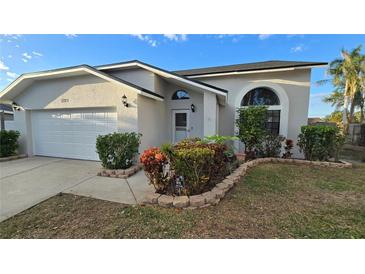 Attractive single-story home with a well-maintained lawn and landscaping at 2015 59Th S Cir, St Petersburg, FL 33712