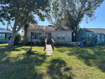 Ranch-style home with a wooden ramp and a grassy yard at 4650 Fairfield S Ave, St Petersburg, FL 33711