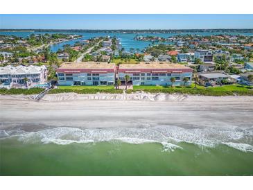 Aerial view of beachfront property, showing building and ocean at 2900 Gulf Blvd # 212, Belleair Beach, FL 33786