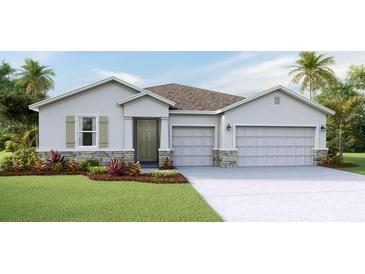 Two-story house with a three-car garage and stone accents at 1011 159Th E Way, Bradenton, FL 34212