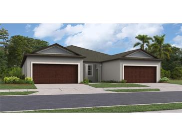 Two-story home with brown garage doors and gray exterior at 12616 Lily Quartz Loop, Parrish, FL 34219