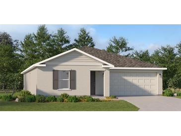 One-story house with a two-car garage and landscaped front yard at 1235 Gantry Rd, North Port, FL 34288