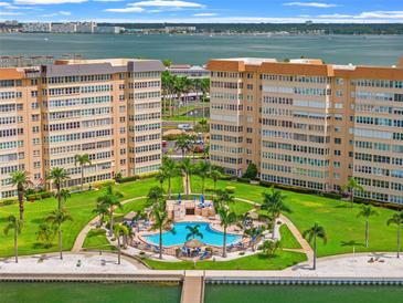 Aerial view of waterfront community with pool and lush landscaping at 5108 Brittany S Dr # 506, St Petersburg, FL 33715