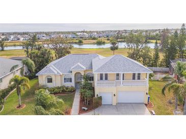 Two story house with double garage and manicured lawn at 924 Bunker View Dr, Apollo Beach, FL 33572