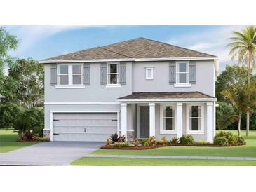Two-story house with gray siding, gray shutters, and a two-car garage at 3542 Thistle Bank Ct, Plant City, FL 33565