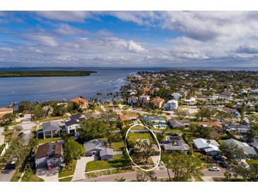 Aerial view of a single Gathering home with pool and large backyard in a quiet residential neighborhood at 5801 Venetian Ne Blvd, St Petersburg, FL 33703