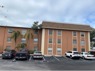 Two-story building exterior with ample parking at 12760 Indian Rocks Rd # 562, Largo, FL 33774