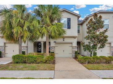 Two-story townhouse with garage and landscaping at 11728 Cambium Crown Dr, Riverview, FL 33569