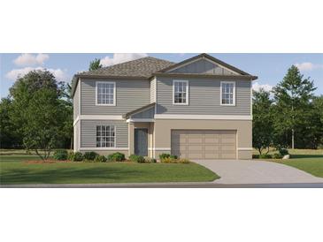 Two-story house with gray siding, beige garage, and landscaping at 3763 Capital Reserve Dr, Plant City, FL 33565