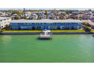 Aerial view of waterfront property with private dock at 250 126Th Ave # 206, Treasure Island, FL 33706