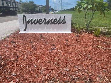 Welcoming Inverness community sign surrounded by lush, well-maintained landscaping at 2593 Countryside Blvd # 7213, Clearwater, FL 33761