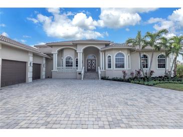 Luxury home with a large driveway and beautifully landscaped grounds at 5264 61St S Ave, St Petersburg, FL 33715