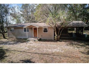 Ranch style home with screened porch and wooded lot at 10019 Curley Rd, San Antonio, FL 33576