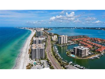 Aerial view of waterfront property with ocean and marina views at 1660 Gulf Blvd # 706, Clearwater Beach, FL 33767