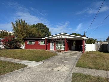 Red brick ranch home with carport and mature landscaping at 4727 W W Wisconsin Ave # Ave, Tampa, FL 33616