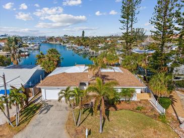 Aerial view of single-Gathering home with private dock and water access at 529 80Th Ave, St Pete Beach, FL 33706