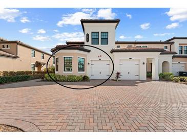 Two-story townhome with two-car garage and attractive landscaping at 10043 Crooked Creek Dr # 101, Venice, FL 34293